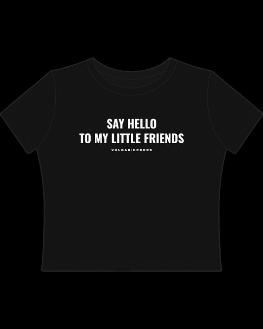 Back view of fitted black baby tee showing cropped shape, short sleeves, and clean cotton finish