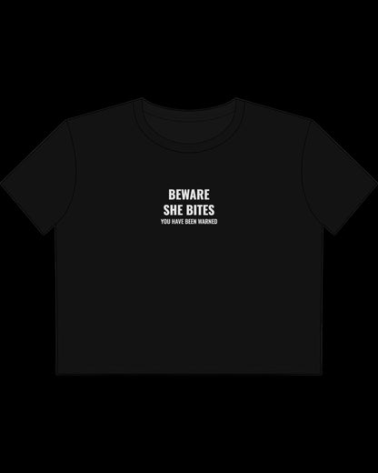 Vulgar Errors Beware She Bites Baby Tee with white chest slogan print on fitted black cotton