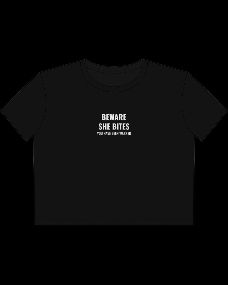 Vulgar Errors Beware She Bites Baby Tee with white chest slogan print on fitted black cotton