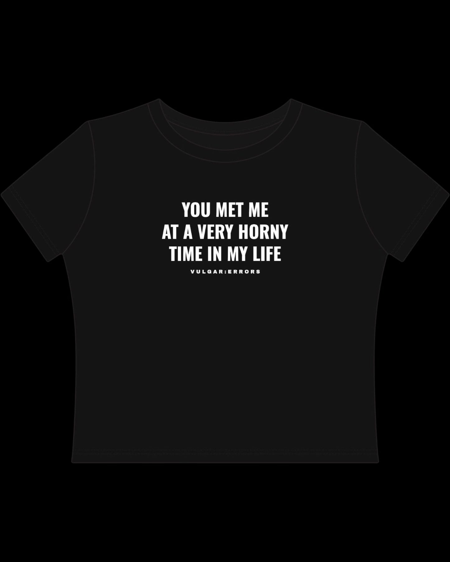 Back view of fitted black baby tee showing cropped shape, short sleeves, and clean cotton finish