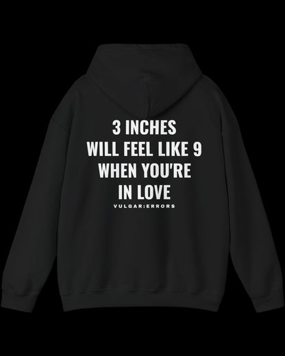 Vulgar Errors 3 Inches Like 9 Hoodie with large white back slogan print on black cotton