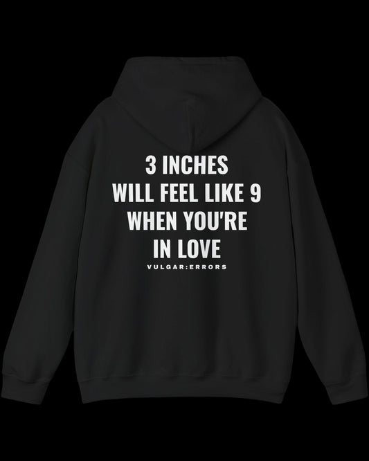 Vulgar Errors 3 Inches Like 9 Hoodie with large white back slogan print on black cotton