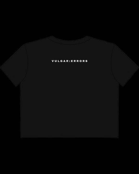 Back view of fitted black baby tee showing cropped shape, short sleeves, and clean cotton finish