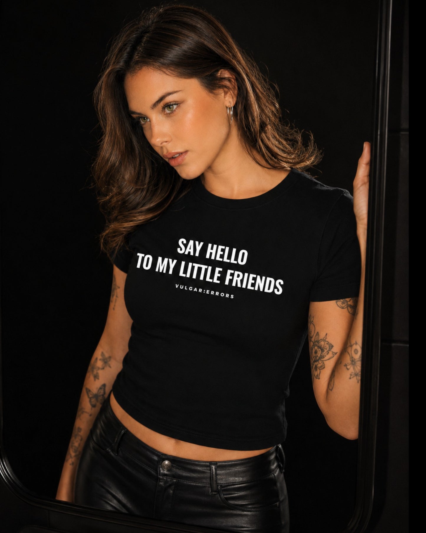 Vulgar Errors Say Hello Baby Tee with white chest slogan print on fitted black cotton