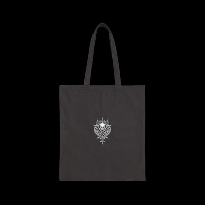 Vulgar Errors black cotton canvas tote bag featuring a detailed white ornate skull crest graphic on the front
